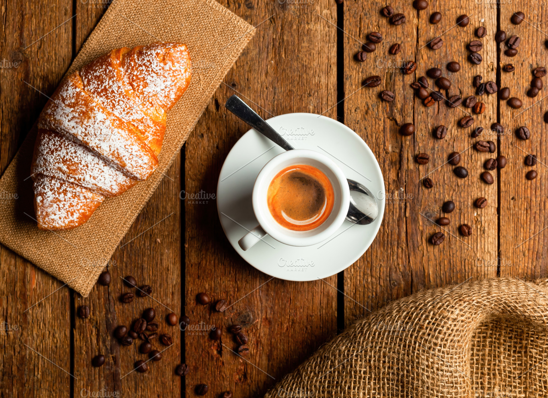 Italian breakfast with espresso coffee and croissant on wooden table, a Food & Drink Photo by Antonio Gravante Market