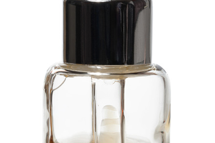 A small, clear glass dropper bottle containing a yellow or amber