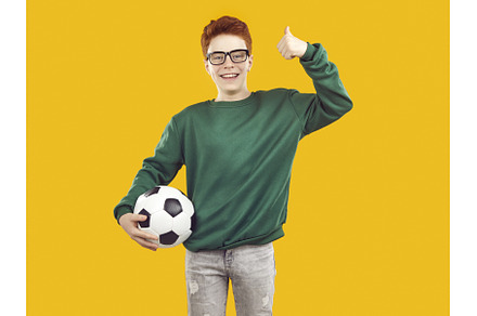 Smiling, happy red-haired boy holds, a Sports & Recreation Photo by StudioRomantic