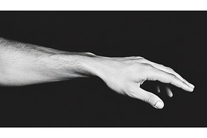 Human hand and arm reaching out in, a Background Photo by Lermont51