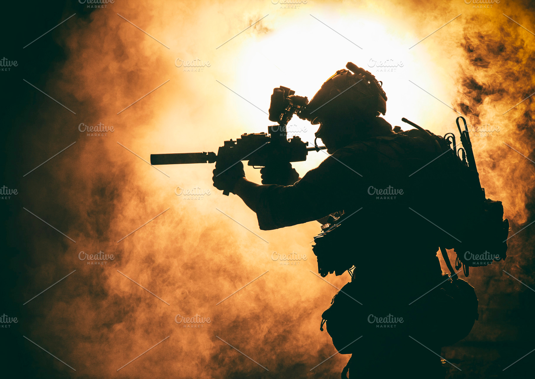Soldier silhouette on background of featuring silhouette, fire, and flame, a Person Photo by Getmilitaryphotos