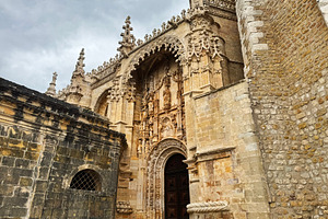Ornate Gothic-style entrance at the Tomar Castle in Portugal with detailed carv, a Photo by AS photostudio