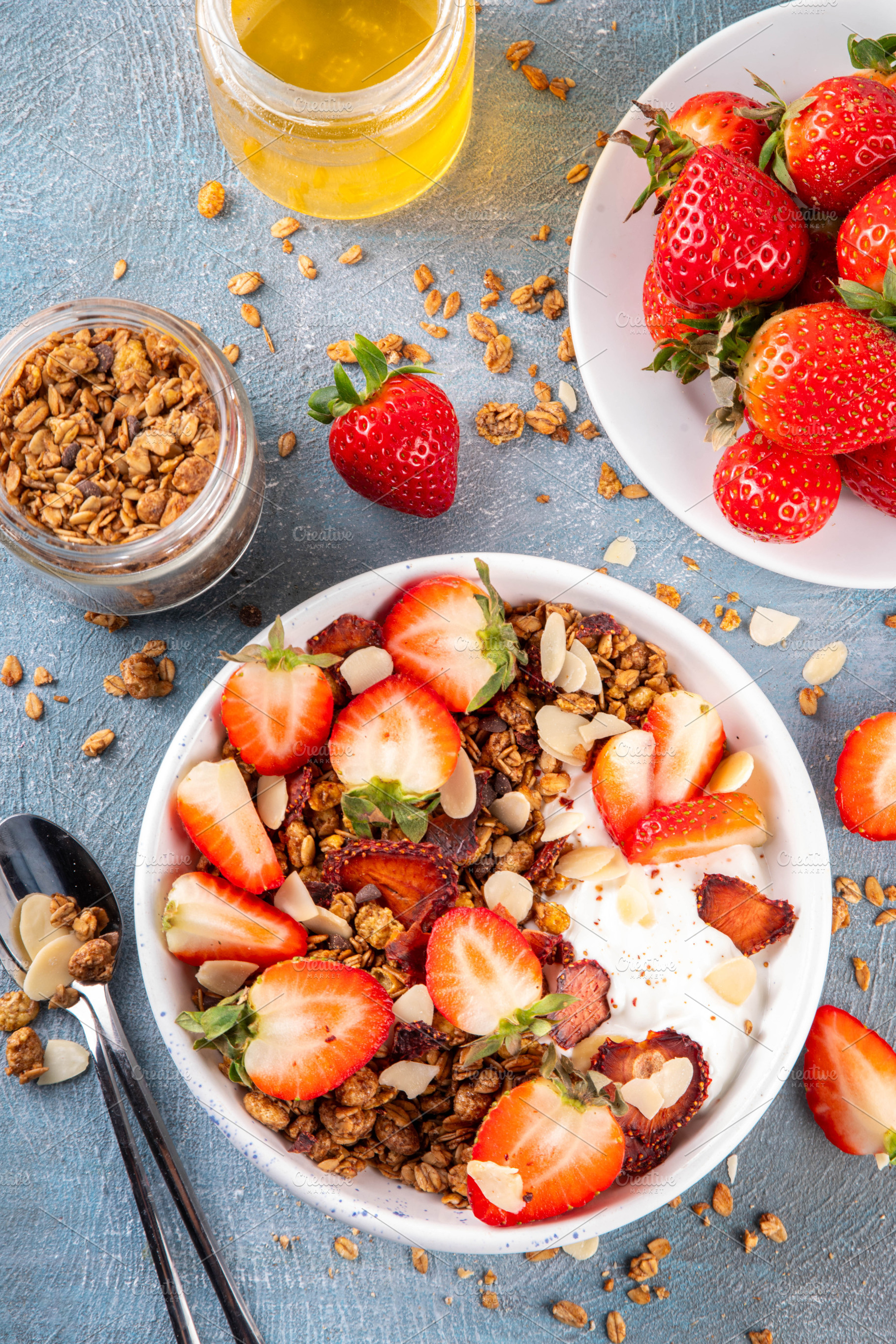 Healthy breakfast bowl with granola, yogurt and strawberry, a Food & Drink Photo by Rimma