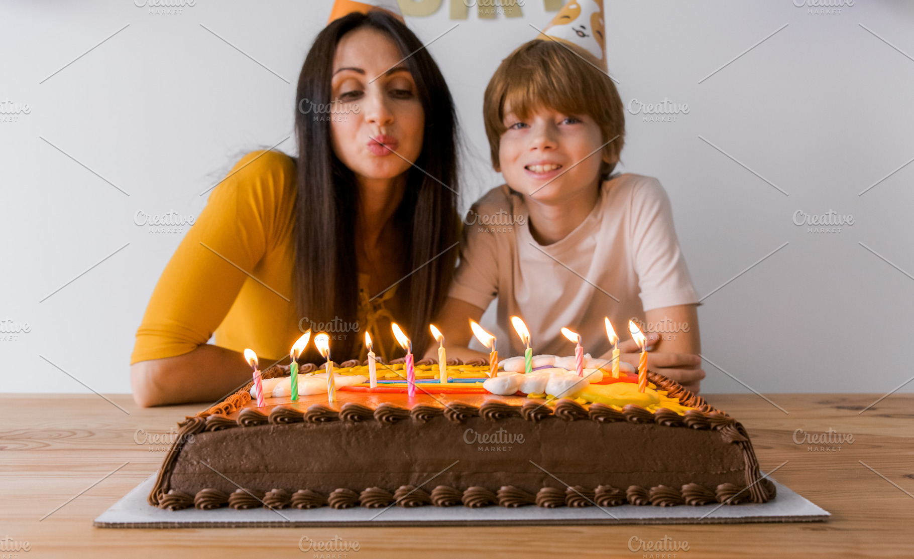 Smiling mother and her young son blo, a Holiday Photo by Kolomiyets Viktoriya