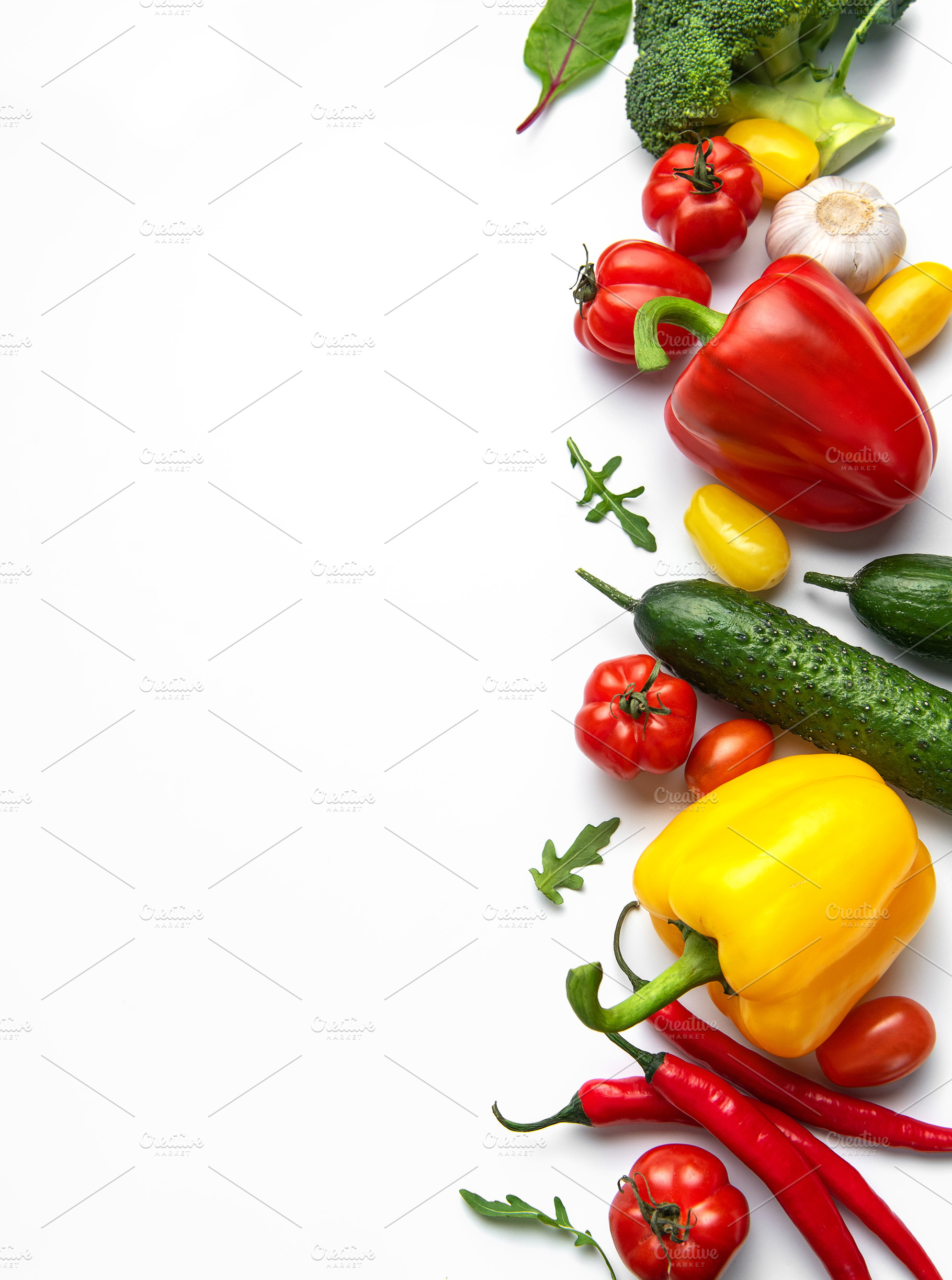 Fresh organic vegetables on white background with copy space, a Food & Drink Photo by Olena Rudo