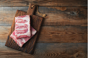 Raw pork ribs with spices, salt and, a Food & Drink Photo by Budarinphoto