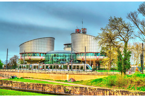 The European Court of Human Rights and a city tram in Strasbourg, France, an Architecture Photo by Leonid Andronov