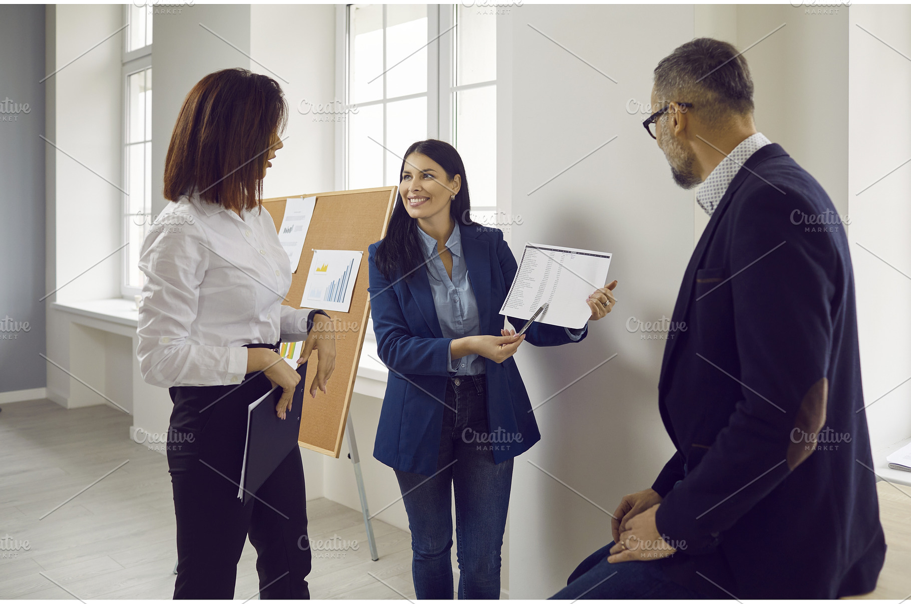 Group of confident business partners, a Person Photo by StudioRomantic