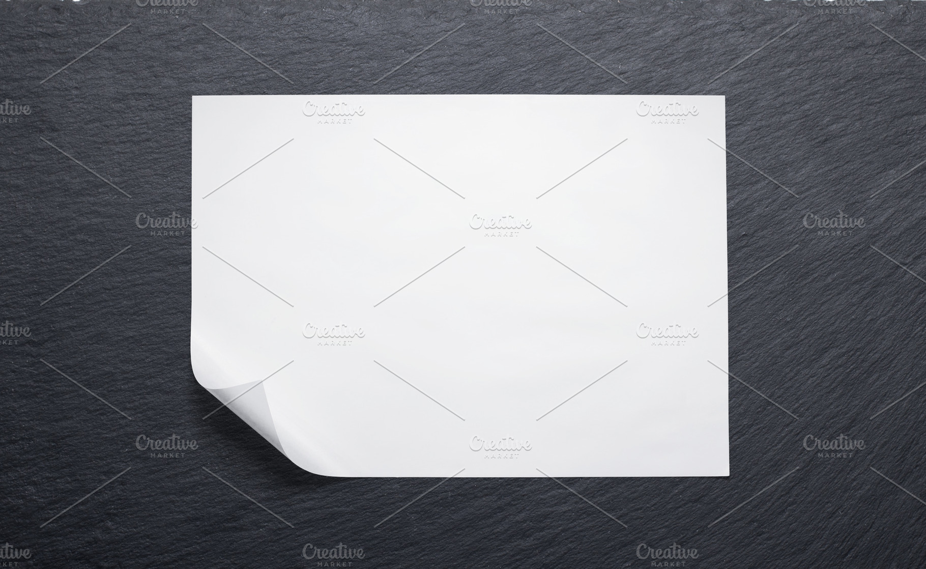 Butcher paper with a folded corner against a slate board, a Food & Drink Photo by rubenchase