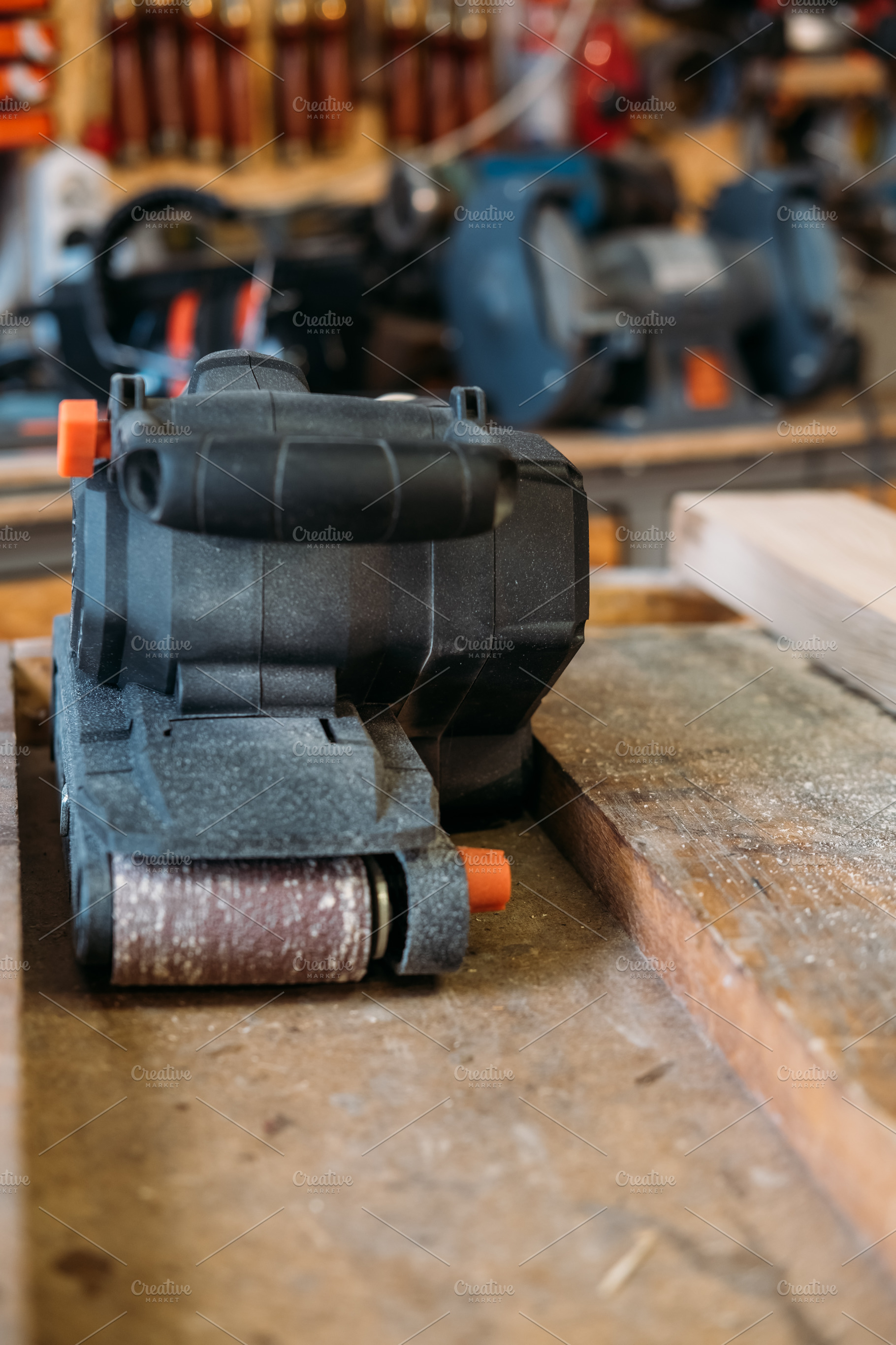 Carpentry equipment belt sander electric tool work, an Industrial Photo by Photo Drive Studio