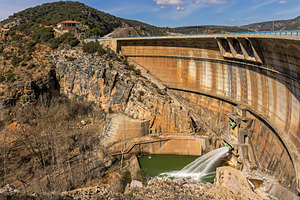 Large Curved Dam with Water Discharg, an Architecture Photo by Perpis