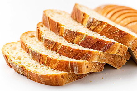 Sliced baked bread isolated on white background, a Food & Drink Photo by AlyaAnd