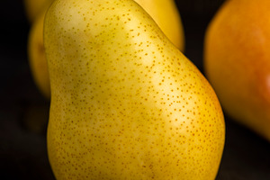 delicious yellow pears with a red side, a Photo by rsoollAI