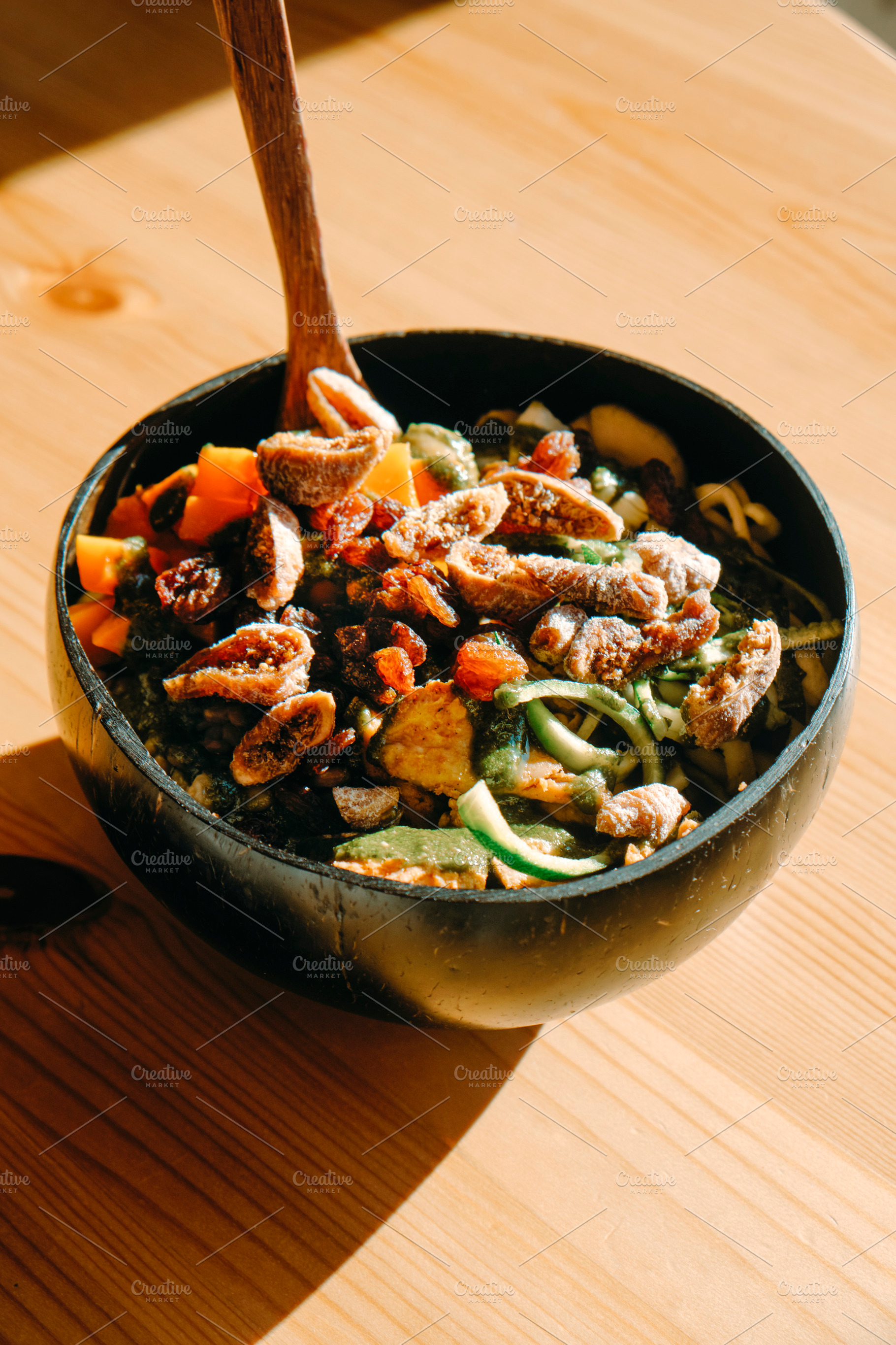 salad served on a coconut bowl, a Photo by Nito