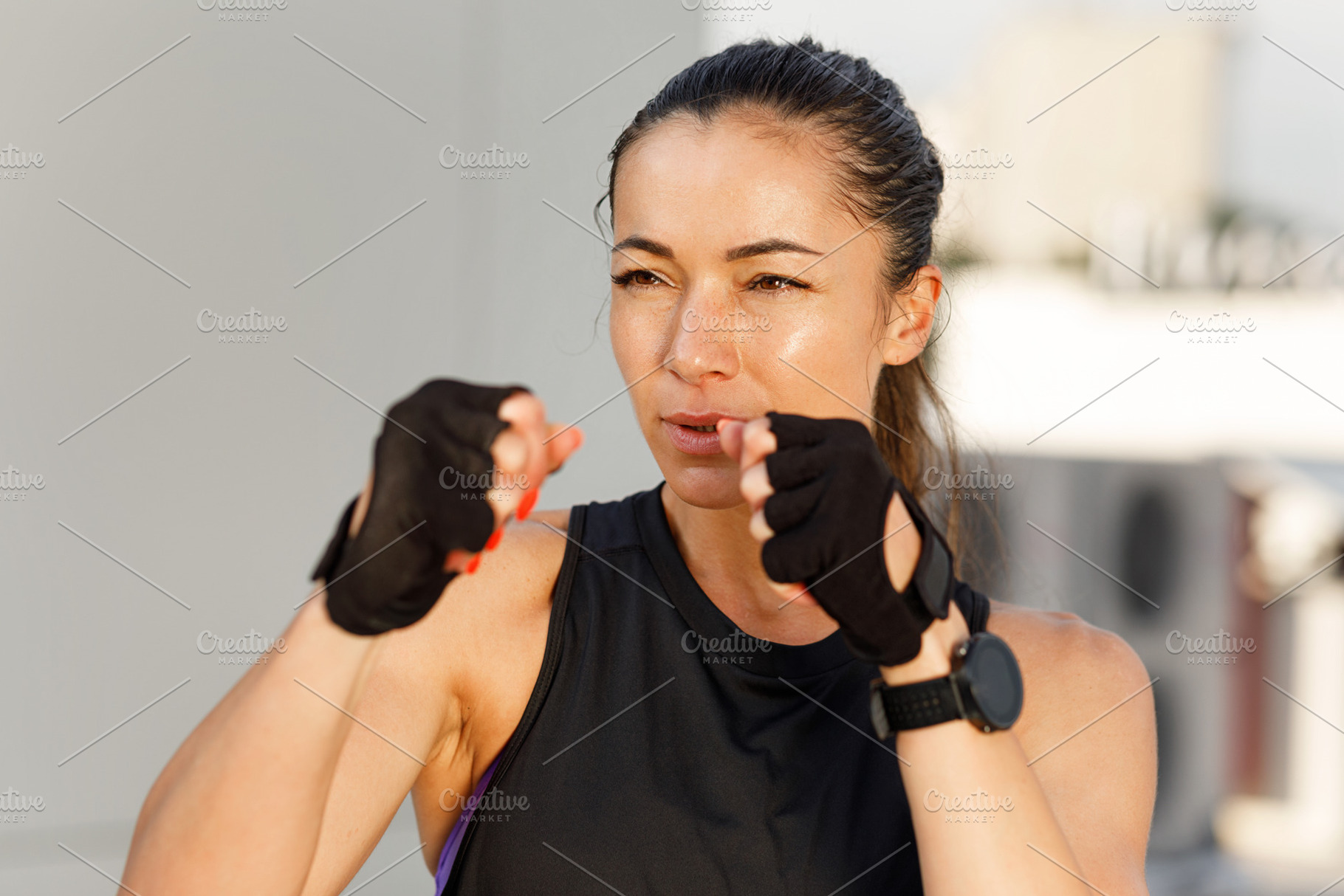 Young woman in fighting stance, a Person Photo by Artem Varnitsin