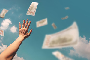 Hands reaching for money floating in the air suggest the endless, a Photo by salmon.black