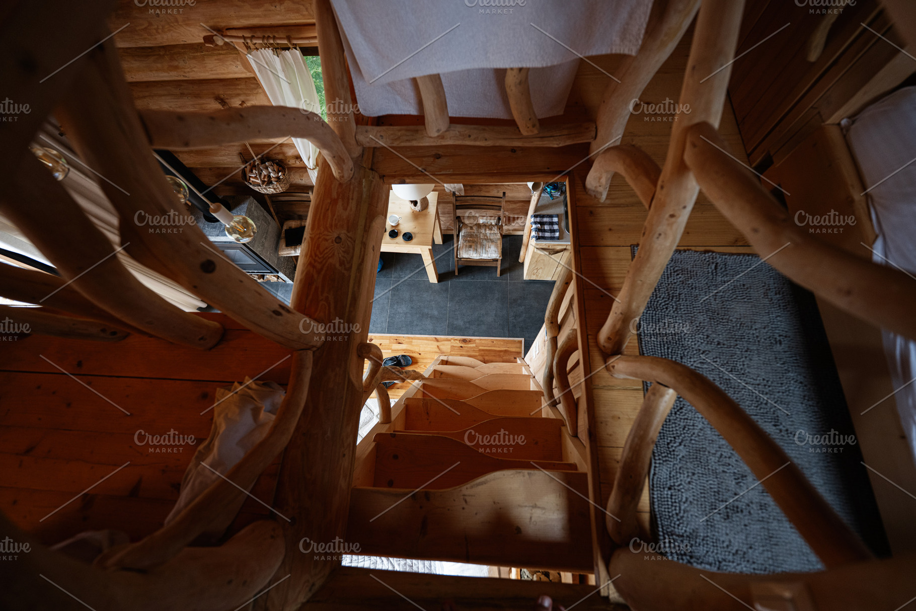 Rustic wooden staircase in cozy cabin with natural wood interior design element, a Photo by AS photostudio