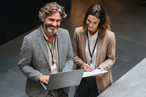 Smiling business colleagues working, a Photo by Pixeness Studio