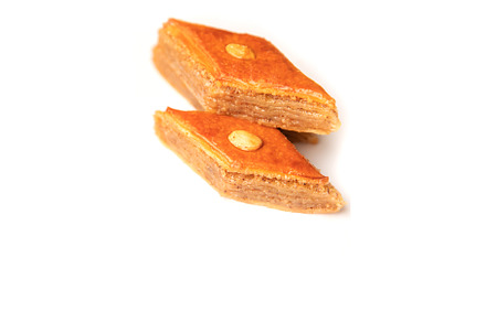Oriental sweet baklava isolate on a, a Food & Drink Photo by yanadjana