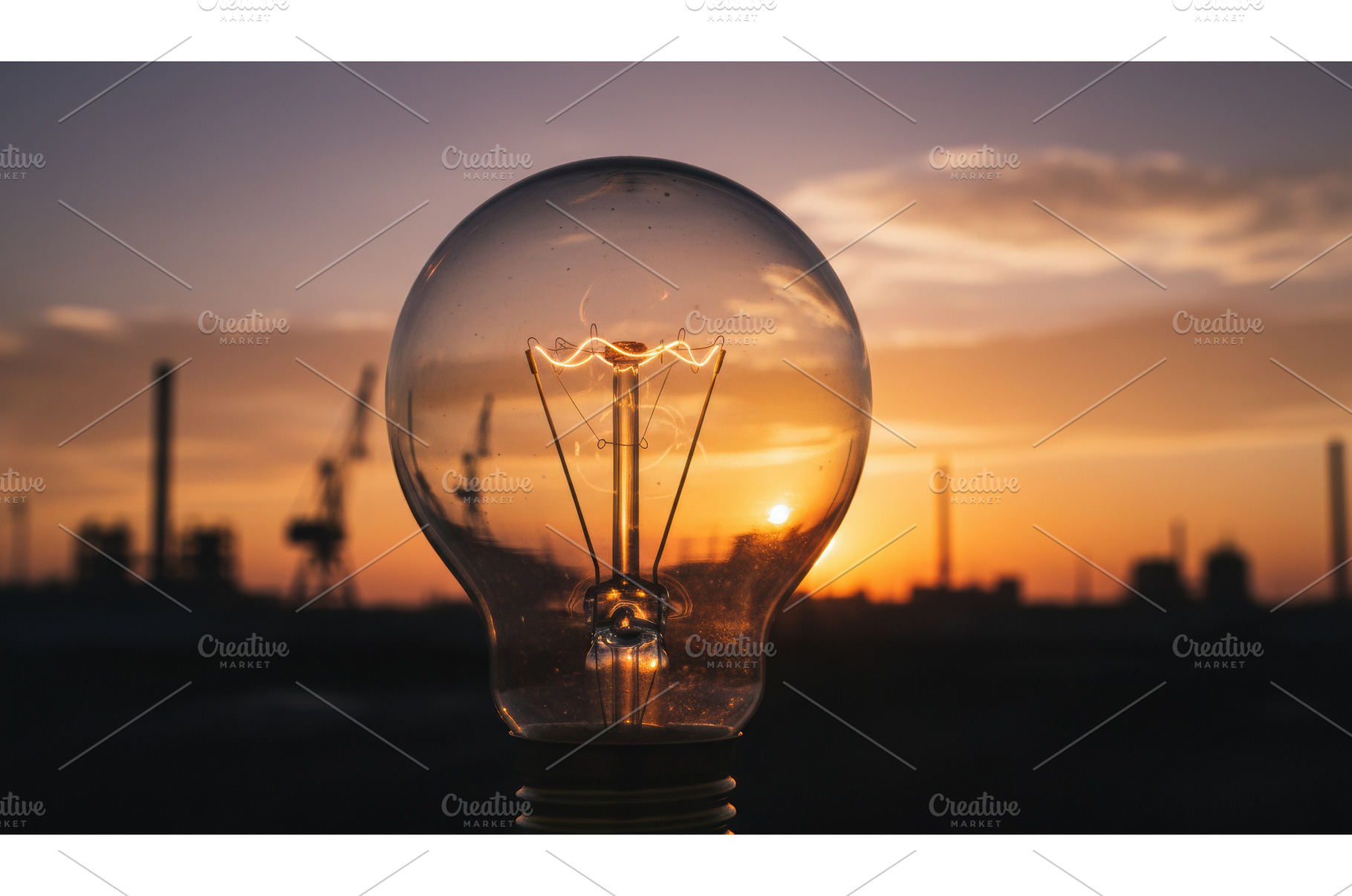 Close up of a glowing light bulb, an Industrial Photo by Igor Tichonow