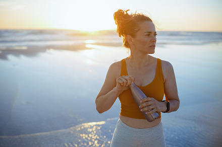 fitness woman jogger in sport clothes at beach in evening, a Sports & Recreation Photo by Alliance Images