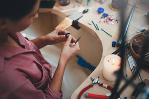Young jeweler designer at workshop stock photo containing accessories and