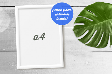 White Frame Mockup w/ Monstera Leaf