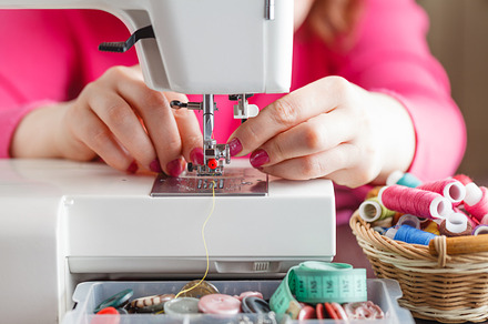 working on a sewing machine, a Background Photo by Andrey Stock Photos