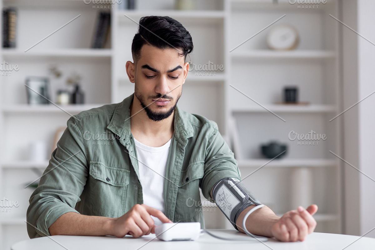 Young Arab Man Checking Blood Pressure With Modern Tonometer At Home, a Photo by Prostock-Studio (Photo 1 of 2)