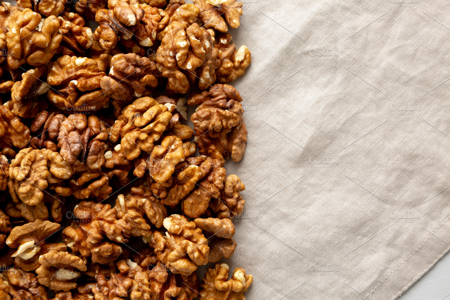 Raw Walnut Halfs, top view. Flat lay, overhead. Space for text., a Food & Drink Photo by LiudmylaChuhunova