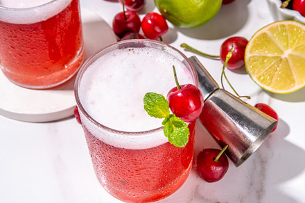 Cherry and lime alcoholic booze cocktail, a Food & Drink Photo by Rimma
