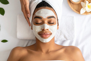 Woman face lying at bed with face mask applied reciving skin tre, a Beauty & Fashion Photo by DanFLCreativo