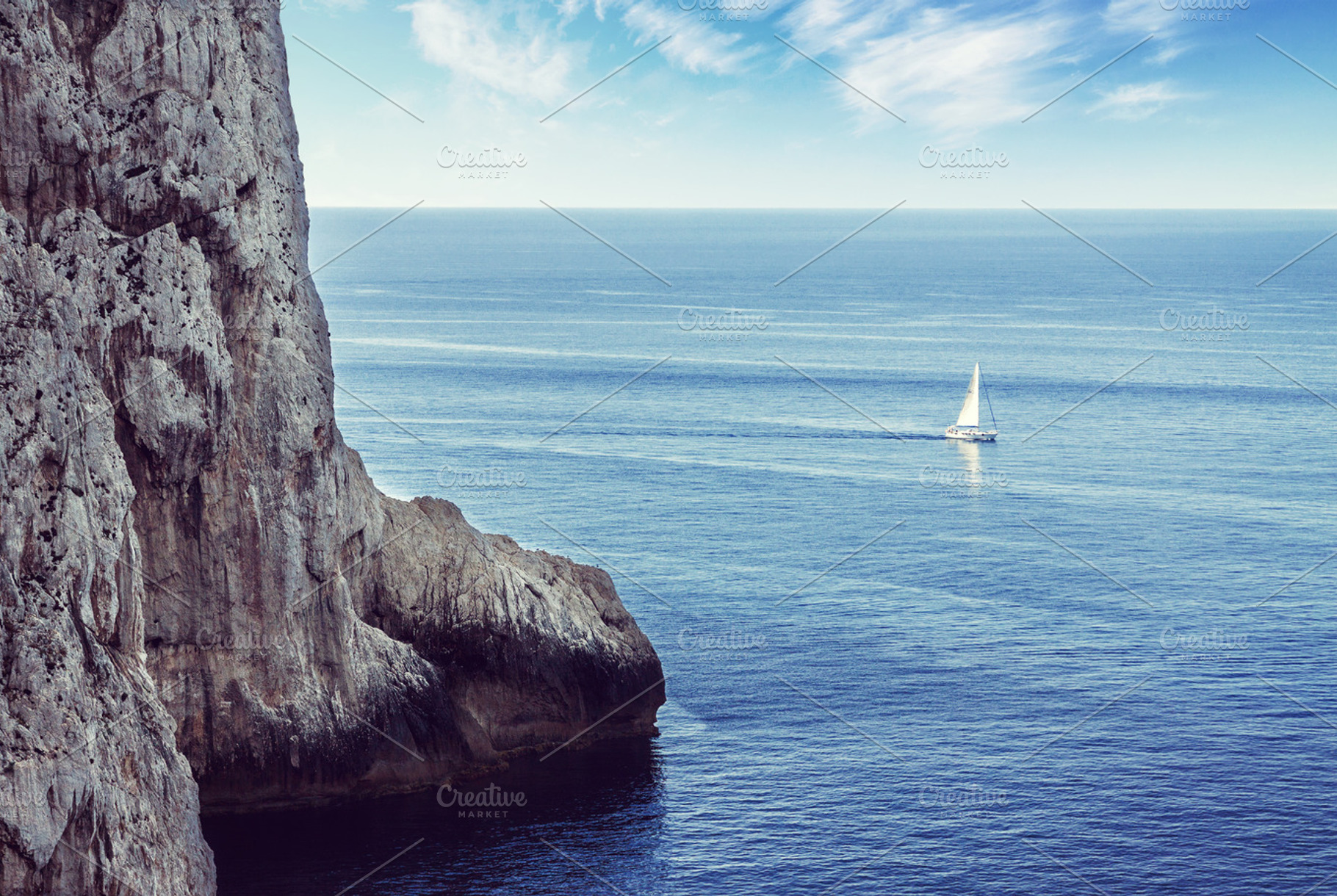 Lonely sailboat sailing on the sea, a Nature Photo by BOOCYS