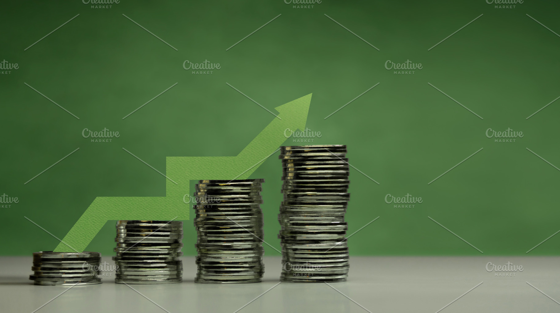 Stacked coins ascending order on green background from Low to Hi, a Photo by salmon.black