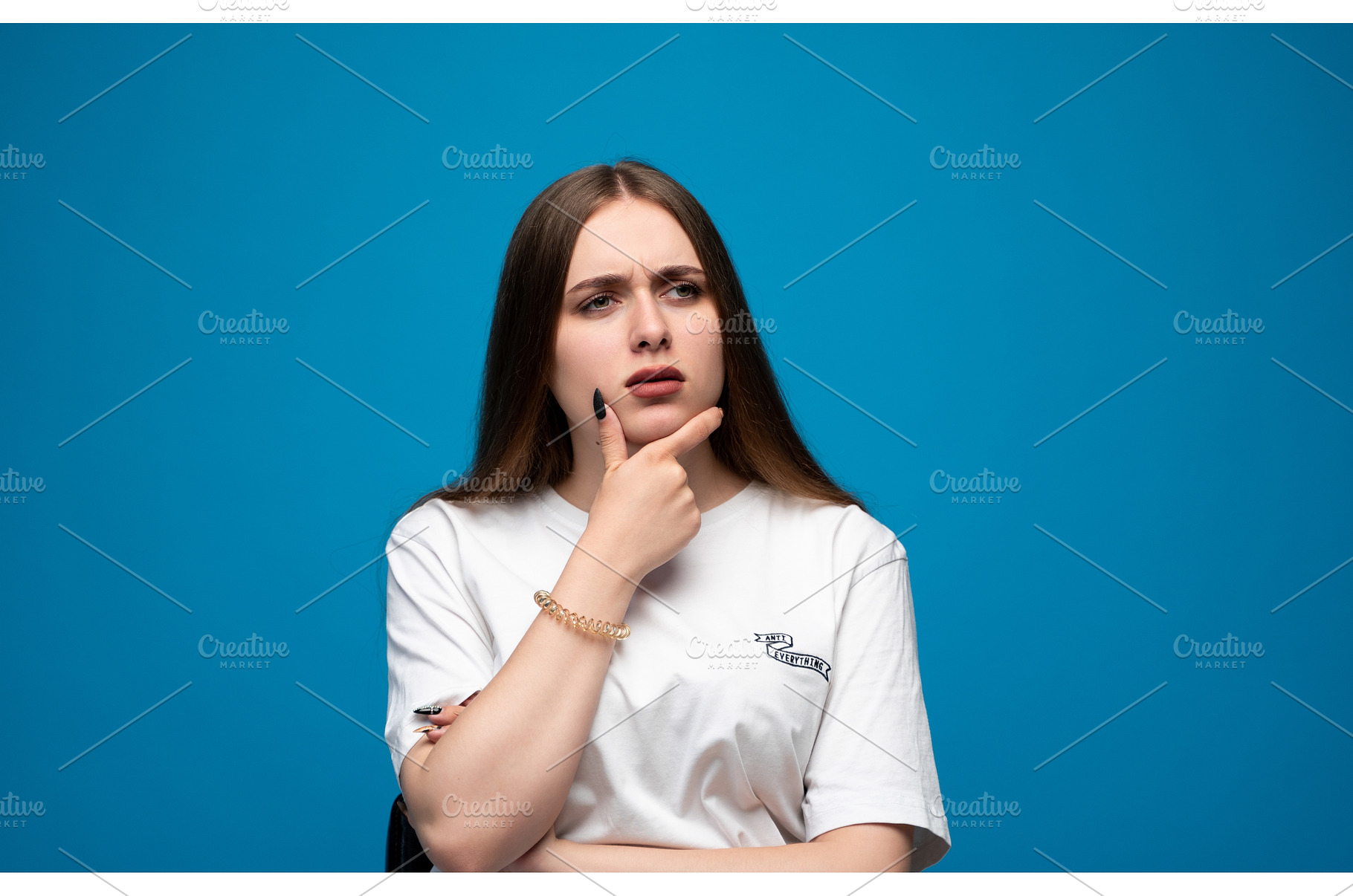 Young woman pondering a difficult, a Person Photo by volodymyrshtun13795