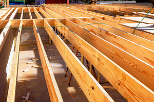 Wooden beams are aligned in building