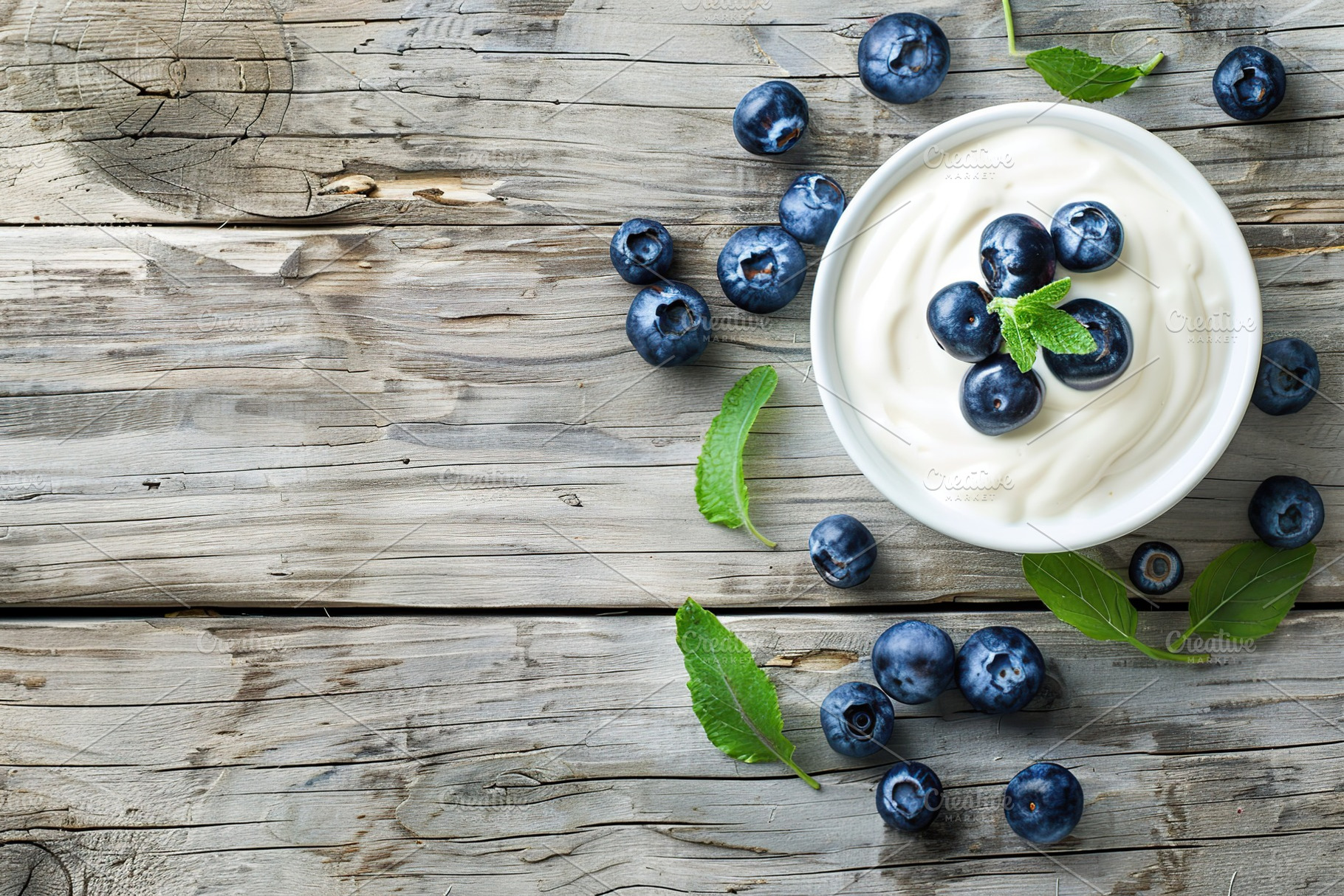 Bowl with fresh blueberries and yogurt on wooden table, a Food & Drink Photo by AlyaAnd