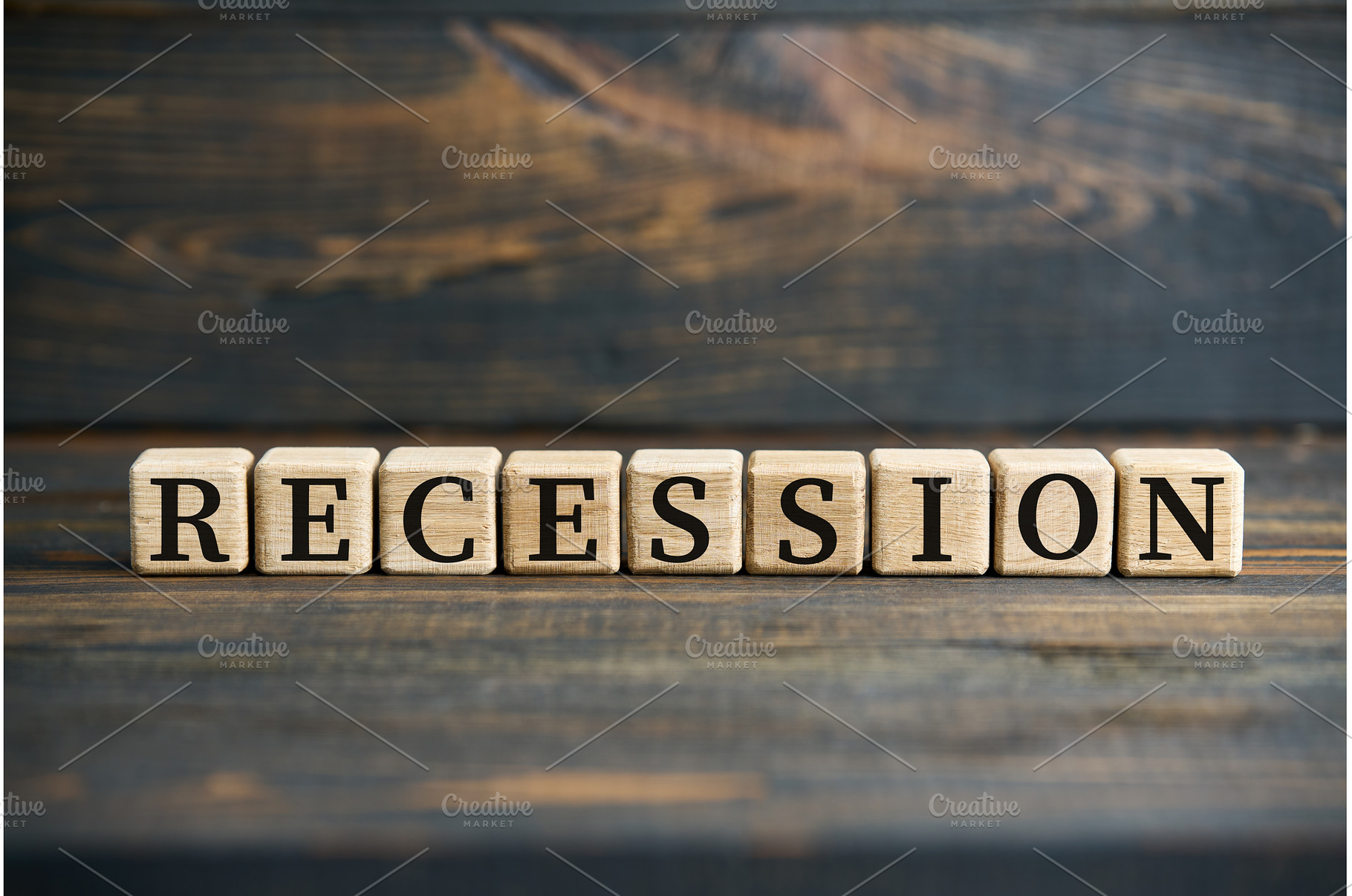 The word RECESSION on wooden cubes, a Business Photo by Gladkov photography