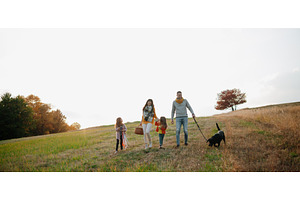 Happy young family with two children, a Person Photo by HalfPoint