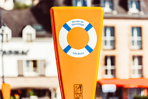Orange life buoy station with signag, a Photo by Dvoevnore photos