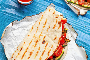 Piadina with grilled zucchini and tomatoes served with orange juice, a Food & Drink Photo by Antonio Gravante Market