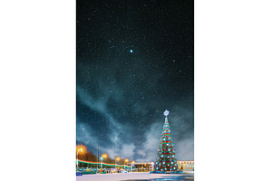 Elegant Christmas Tree Illuminated, a Holiday Photo by Our Amazing World