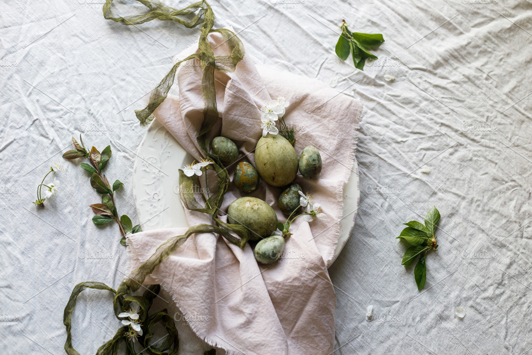 Happy Easter! Stylish natural dyed eggs and spring flowers on li, a Holiday Photo by Sonjachni