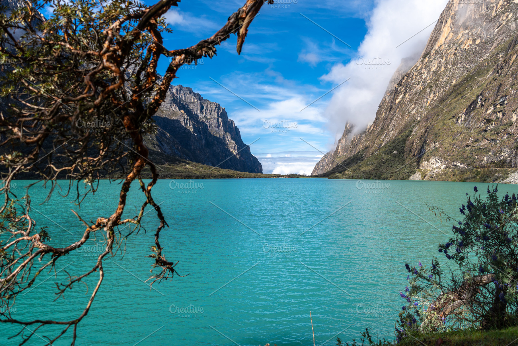 Turquoise lake surrounded by mountains on the Laguna 69 trek, Pe, a Nature Photo by GoodGoods