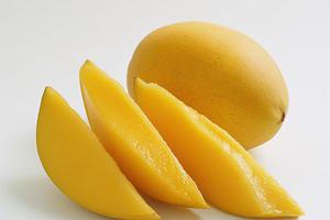 Mango with mango slices and green le, a Food & Drink Photo by Pixeness Studio