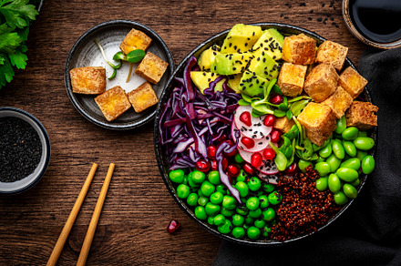 Vegan buddha bowl with red quinoa, fried tofu, avocado, edamame, a Food & Drink Photo by 5PH