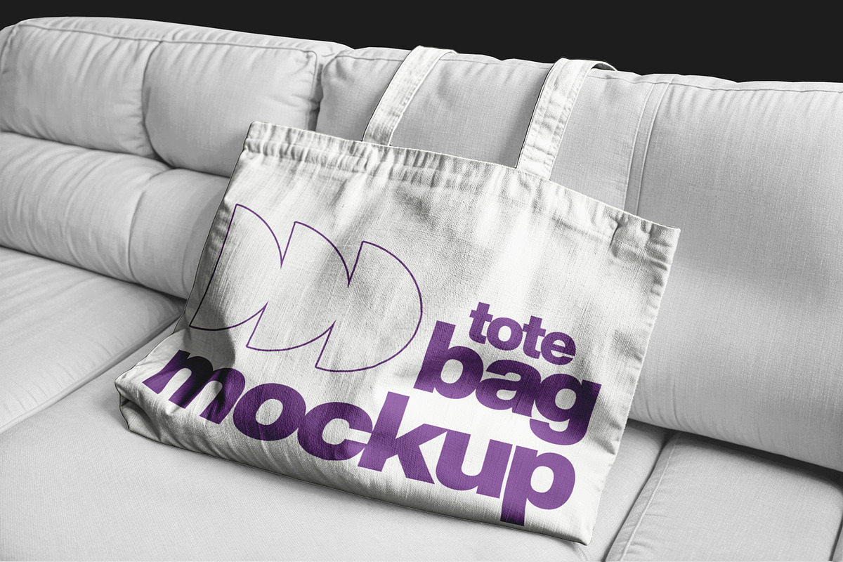 Totebag on Sofa, an Apparel Mockup by sagesmask.com (Photo 2 of 3)