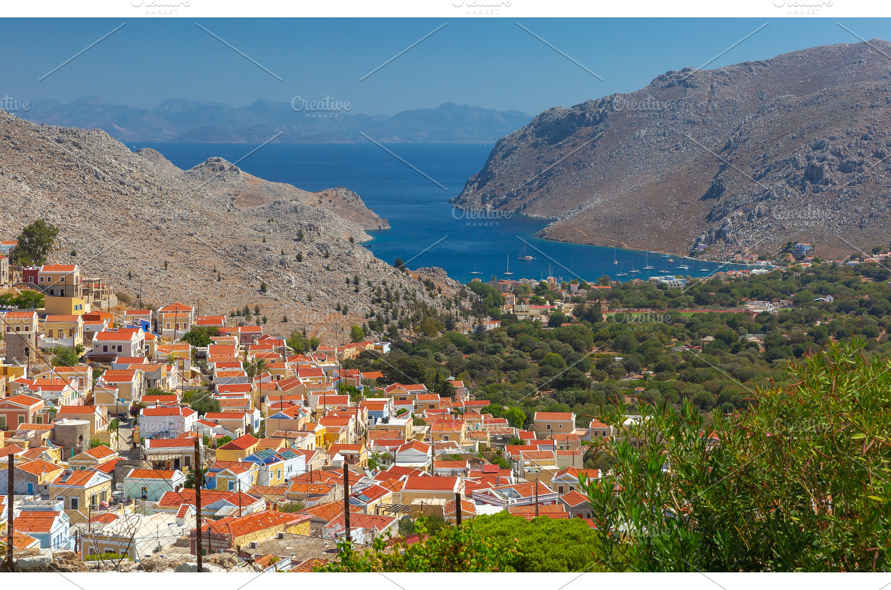 Symi village and bay panorama with, an Architecture Photo by kavalenkava