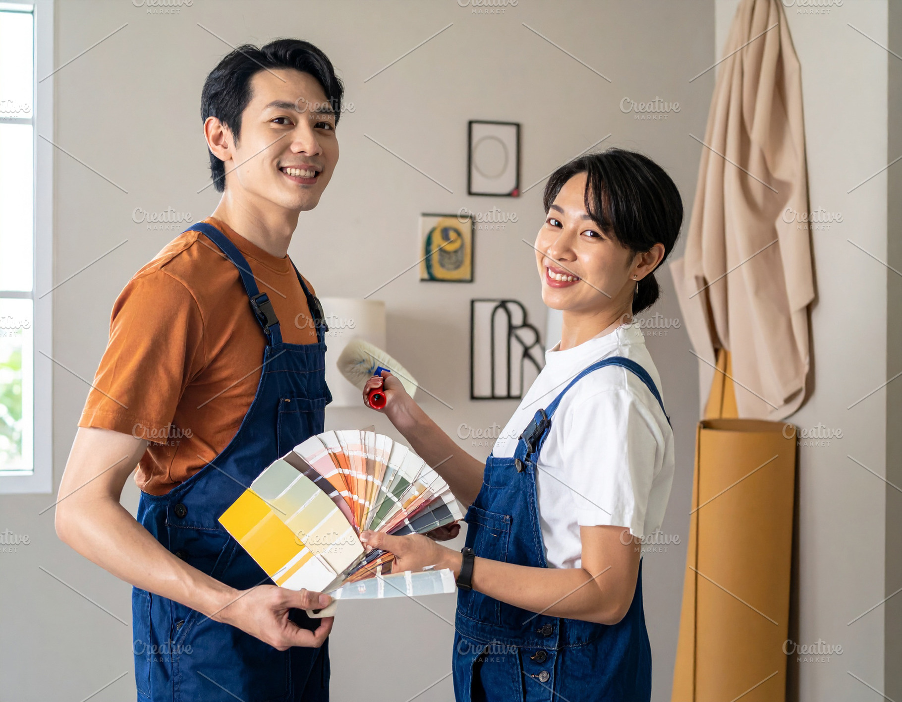 Interior decorators working together in a well lit home setting, a Person Photo by DanFLCreativo