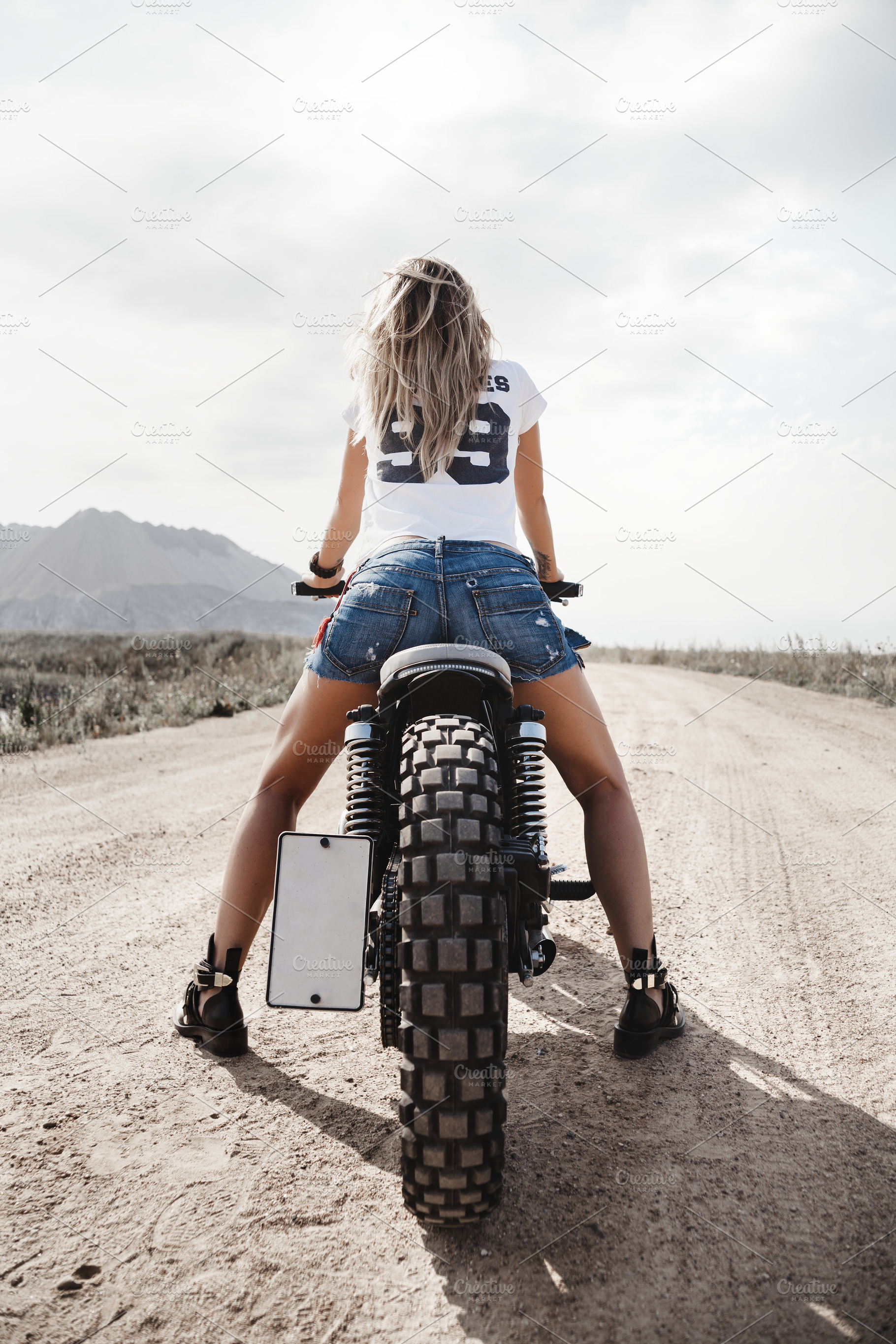 Biker girl and custom motorcycle, a Transportation Photo by Aliaksei Kaponia